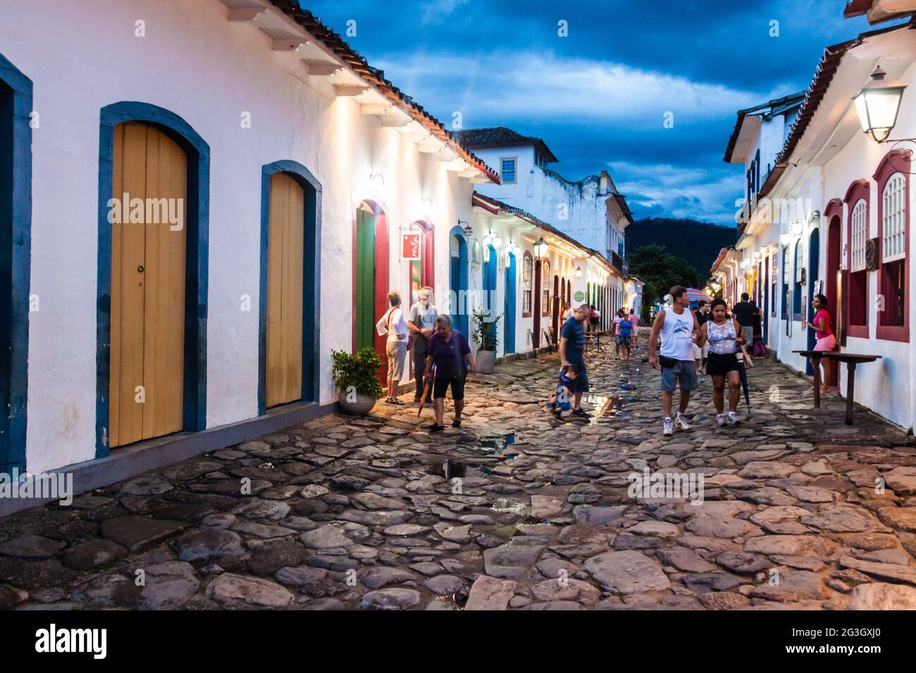 PARATY, BRAZIL - JANUARY 30, 2015: People walk in a narrow street an old colonial town Paraty, Brazil Stock Photo