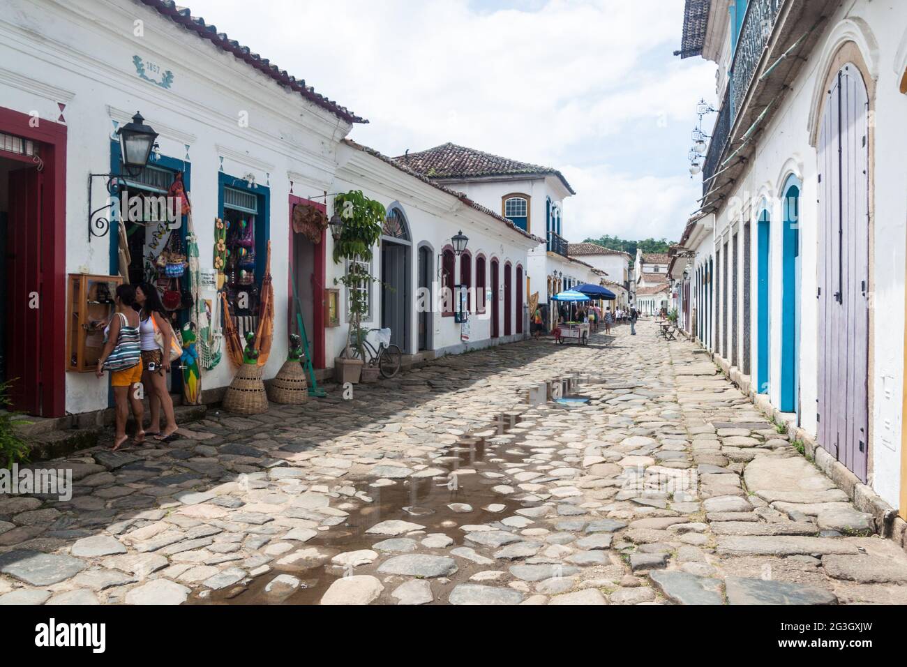 PARATY, BRAZIL - FEBRUARY 1, 2015: People walk in a narrow street an old colonial town Paraty, Brazil Stock Photo