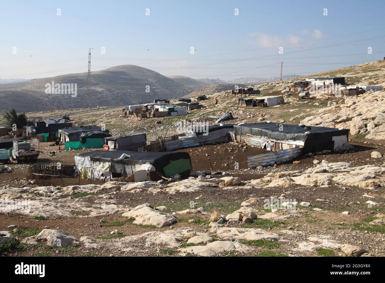 Tin made shacks in an illigal Beduin nomad settlement in the Judean Desert. These are nomads who settled here illigally as it is in Zone C West Bank. Stock Photo