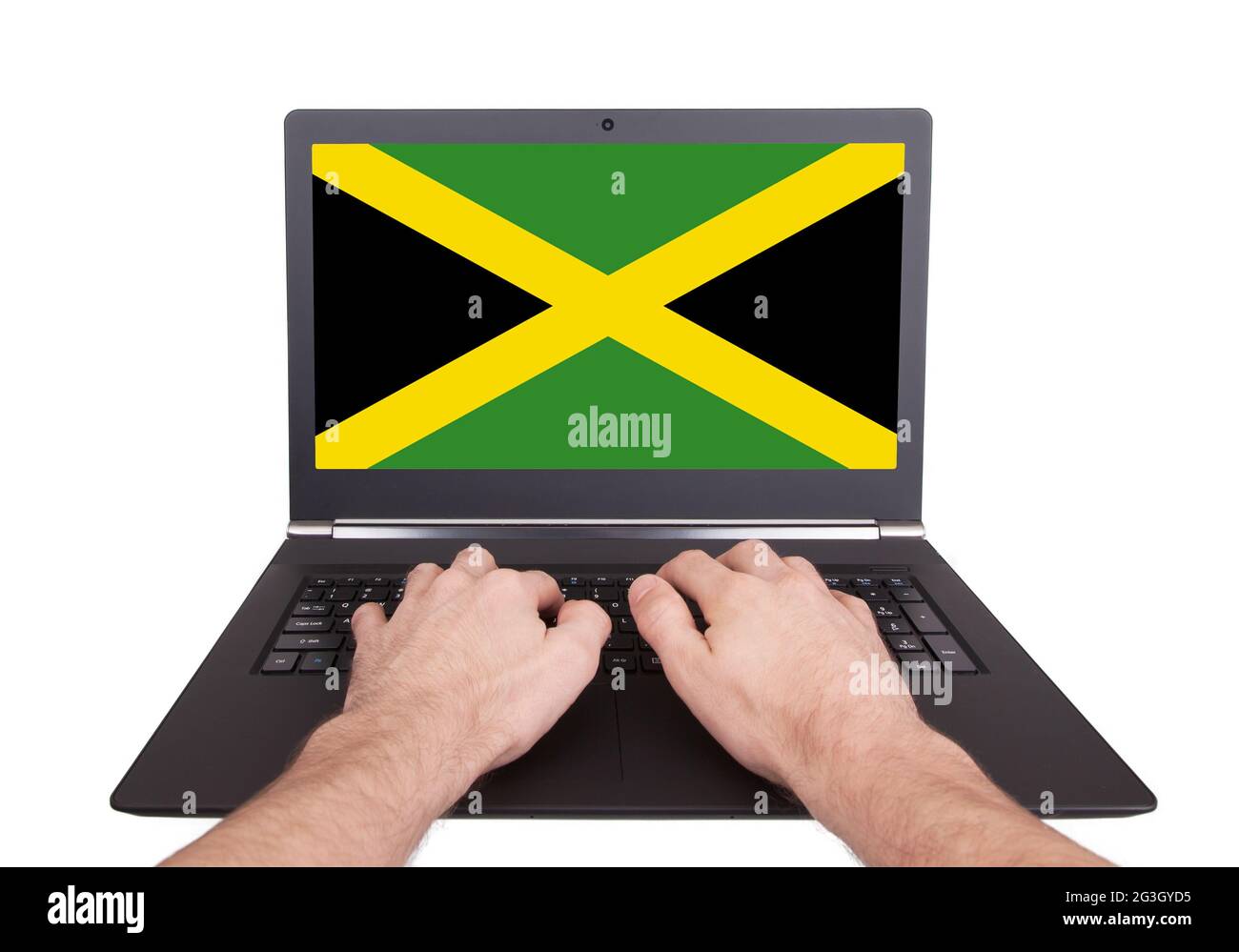 Hands working on laptop, Jamaica Stock Photo Alamy