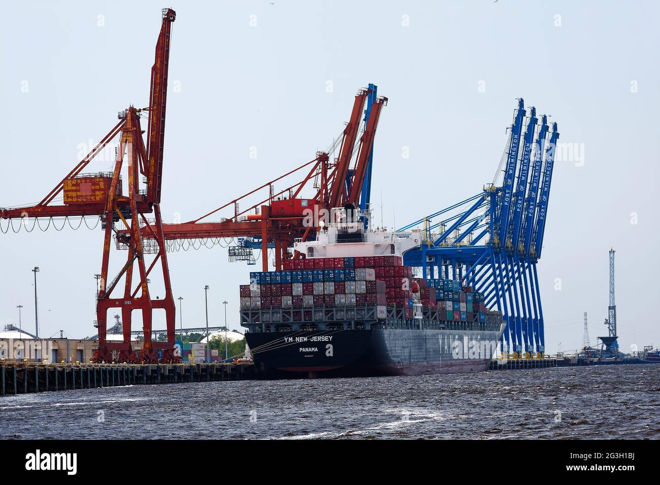 large cargo ship docked; cargo containers; bulk carrier, work boat
