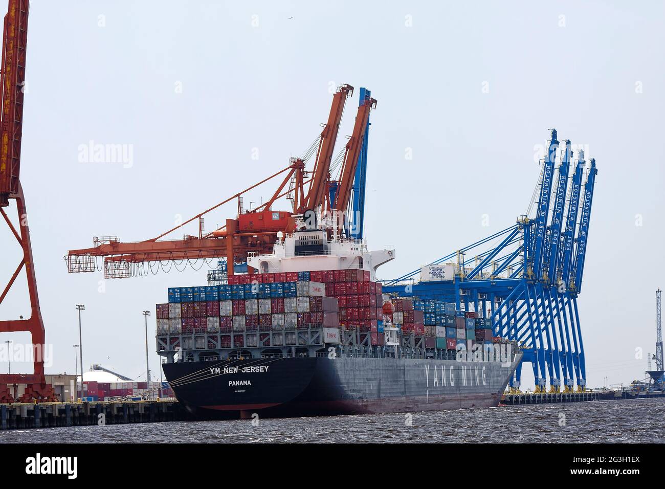 large cargo ship docked; cargo containers; bulk carrier, work boat