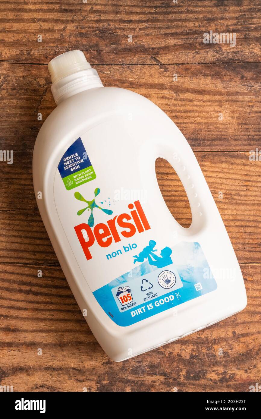 Irvine, Scotland, UK - June  15, 2021: Persil Branded Non Bio liquid detergent in white plastic bottle and cap that is recyclable and displaying 100% Stock Photo