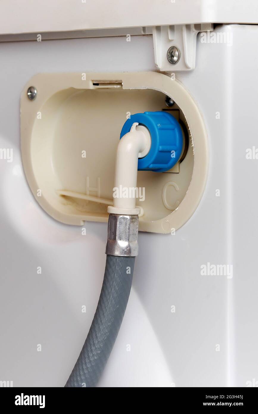 water supply hose connected to washing machine Stock Photo - Alamy