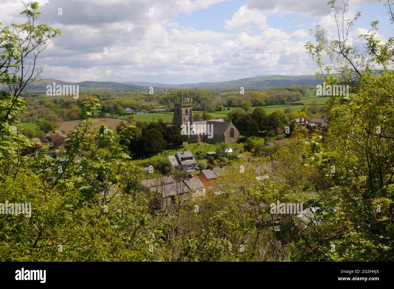 View of the church and part of the town of Montgomery from near the castle in Montgomery, Montgomeryshire, Wales Stock Photo