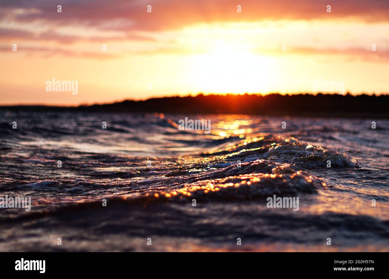sea wave close up at sunset, low angle view, cross processing effect Stock Photo