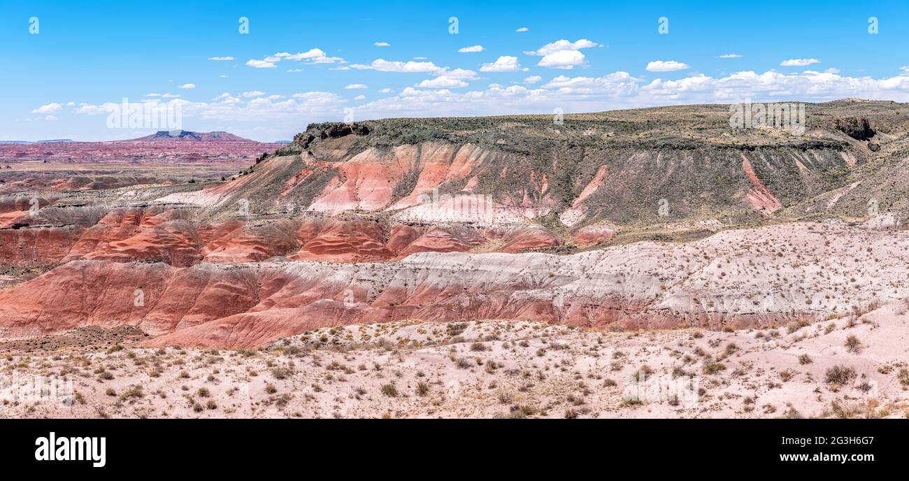 Panoramic view of the Painted Desert National Park mountains shows the beautiful geologic formation, patterns and colors that give this park its name. Stock Photo