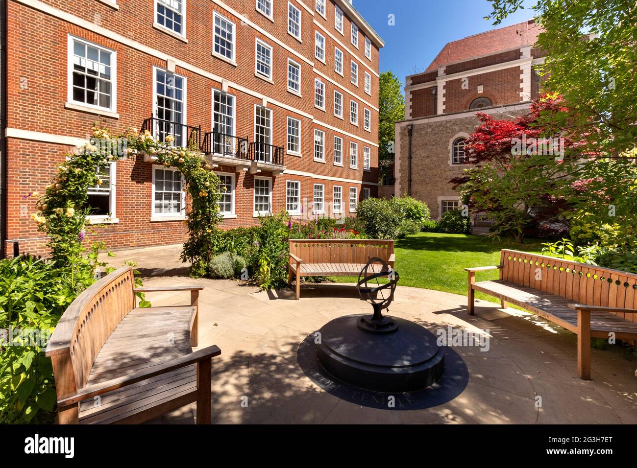LONDON ENGLAND MIDDLE TEMPLE GARDENS WITH WOODEN BENCHES COMPASS