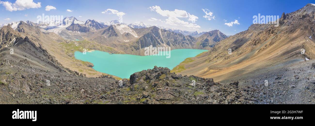 Scenic panorama of picturesque turquoise lake in Tien-Shan mountains in Kyrgyzstan Stock Photo