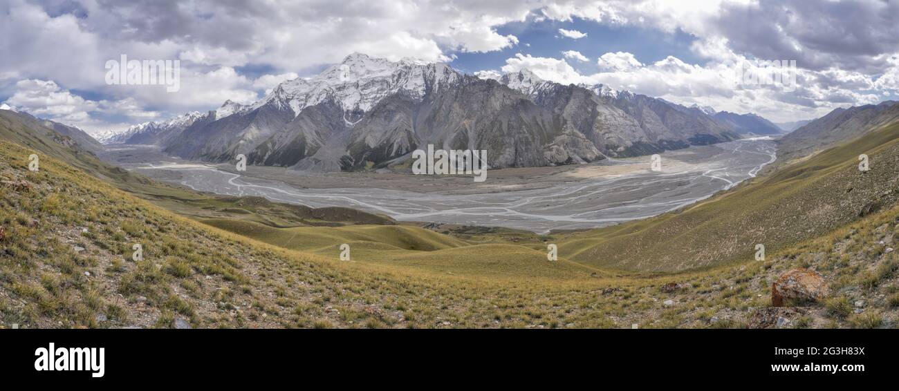 Scenic panorama of valley and mountain peaks in Tien-Shan mountain range in Kyrgyzstan Stock Photo