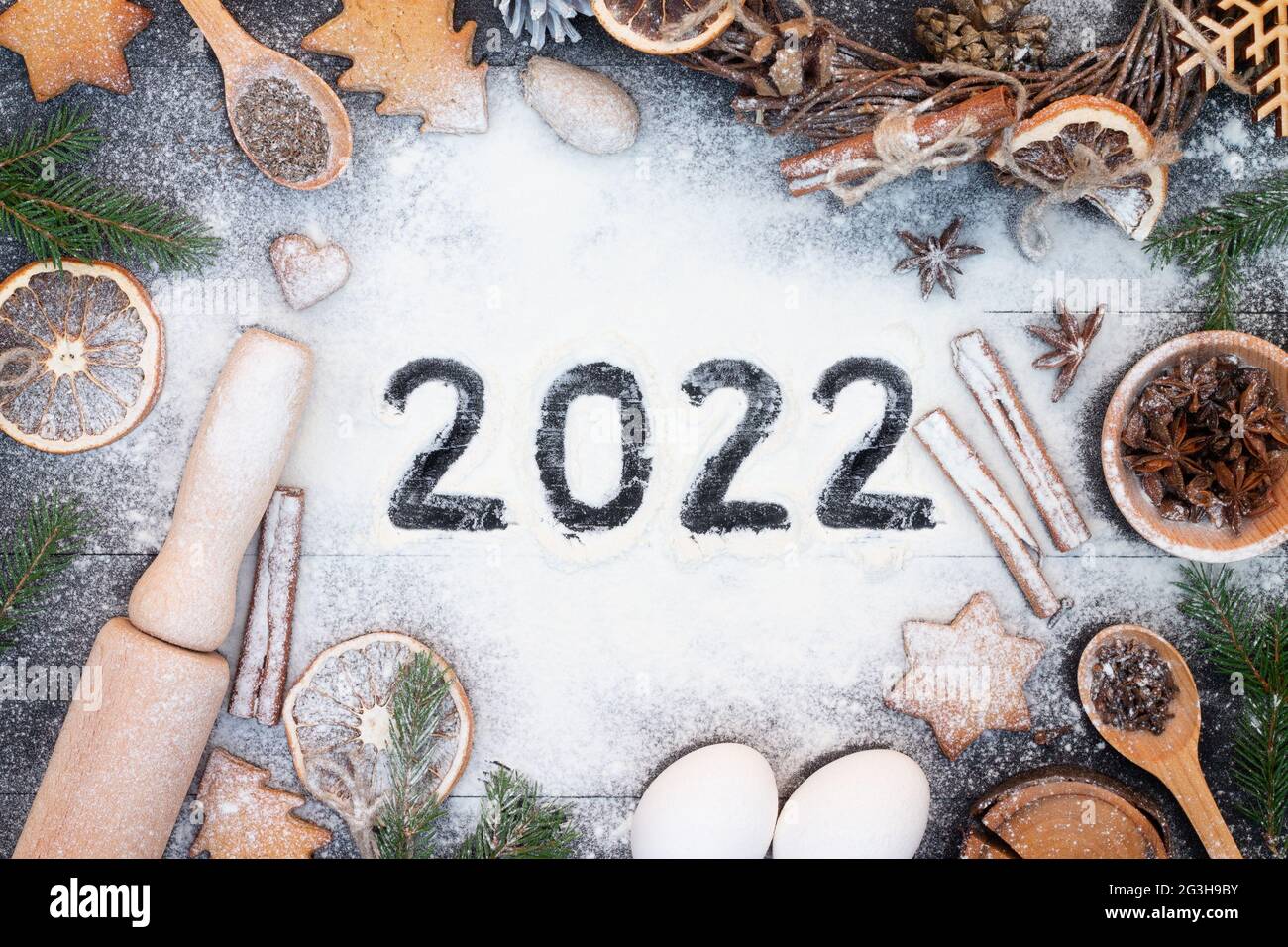 Christmas In Woods 2022 Happy New Year 2022 Written On Flour. Christmas Tree Branches, Gingerbread  Cookies, Spices And Baking Supplies On Black Wood Background. Christmas, Ne  Stock Photo - Alamy