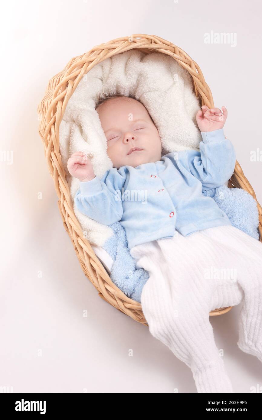 New Born Baby Sleeps In Basket Stock Photo Alamy