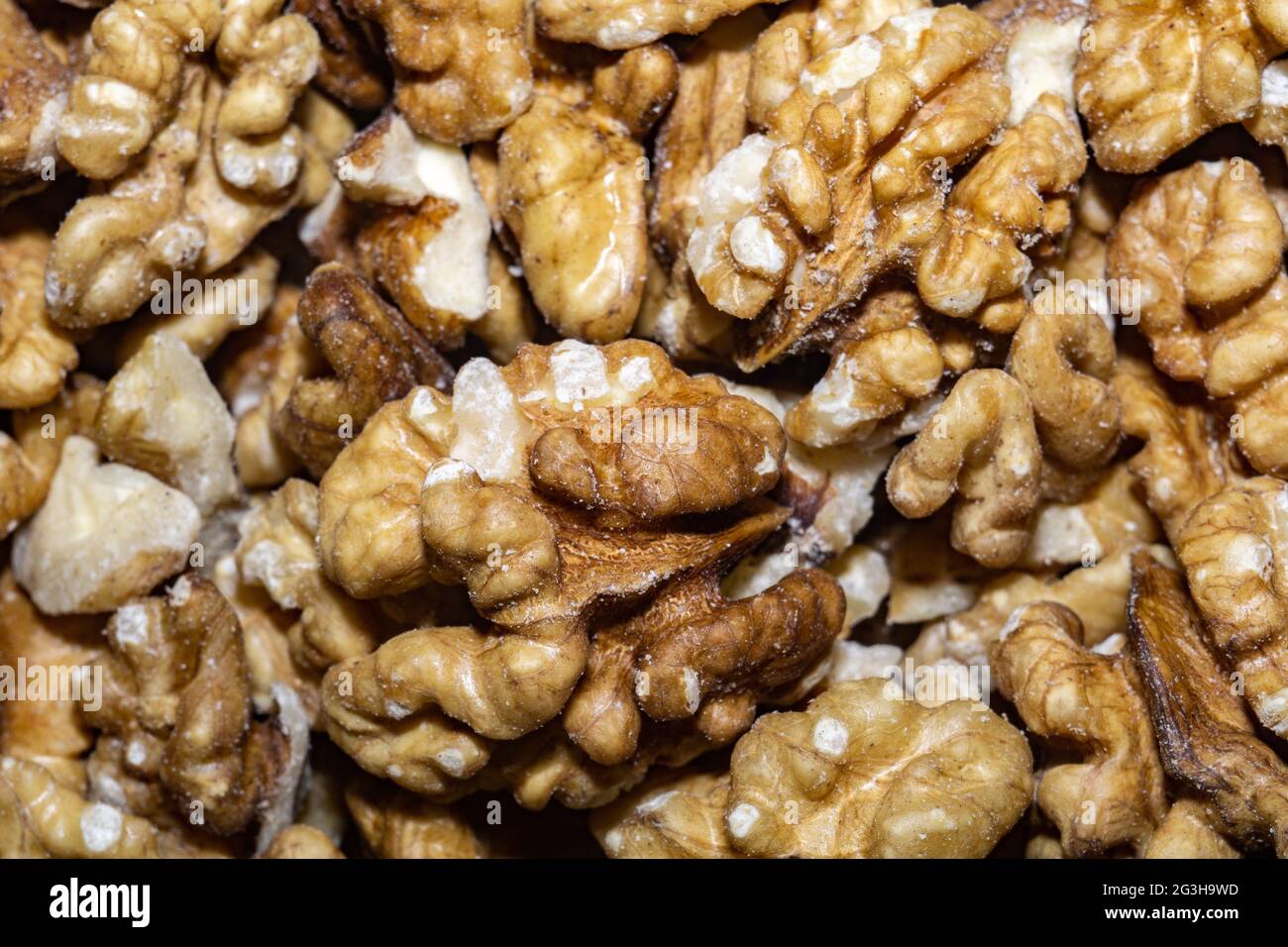 Close up background with peeled walnuts, macro photo. Stock Photo