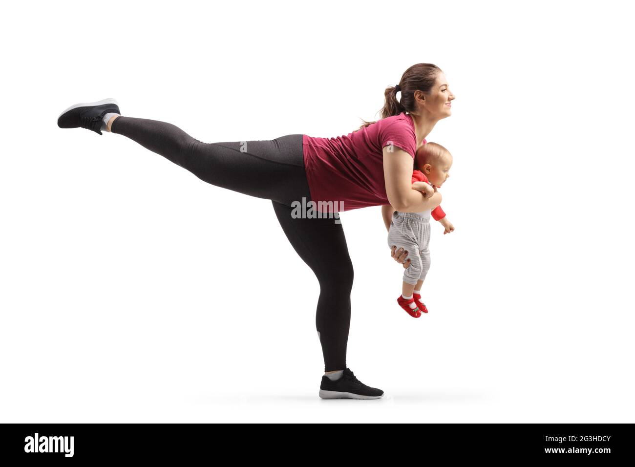 Woman exercising with a baby in her hands isolated on white background Stock Photo