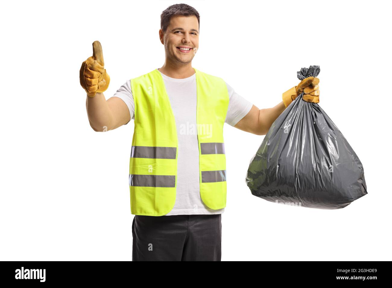 Waste collector holding a black plastic bin bag and showing thumbs up isolated on white background Stock Photo