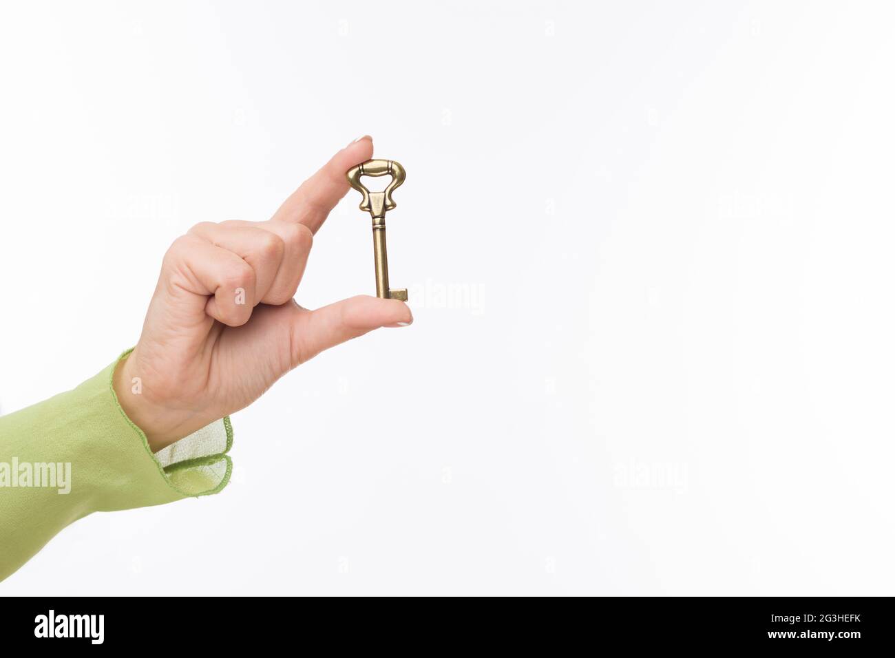 Hand with old key Stock Photo