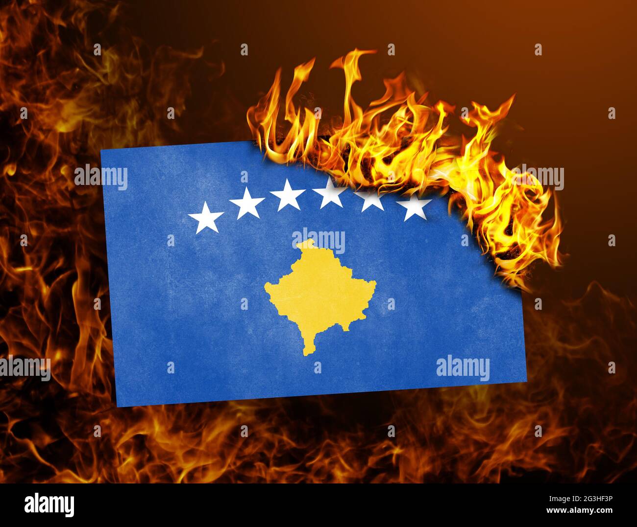 Flag burning - Kosovo Stock Photo