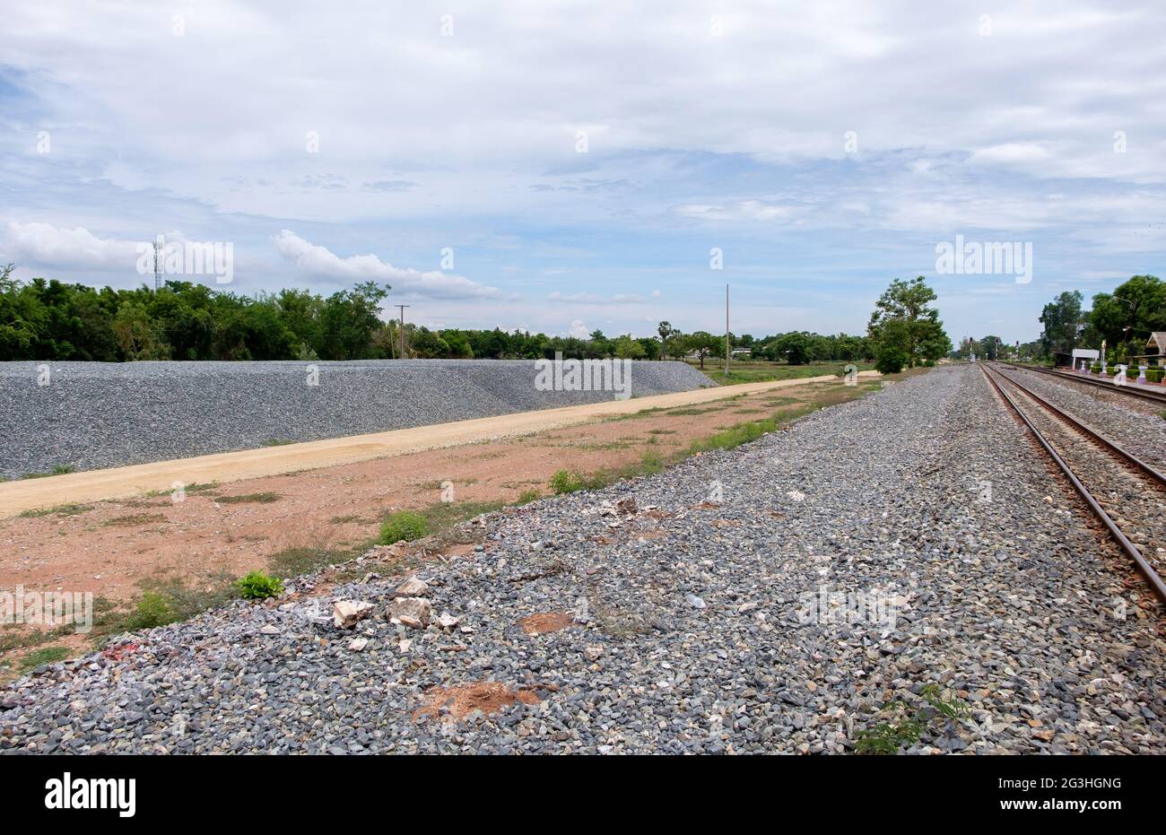 The large stone pile for construction of the double-track project near the local train station,  front view with the copy space. Stock Photo