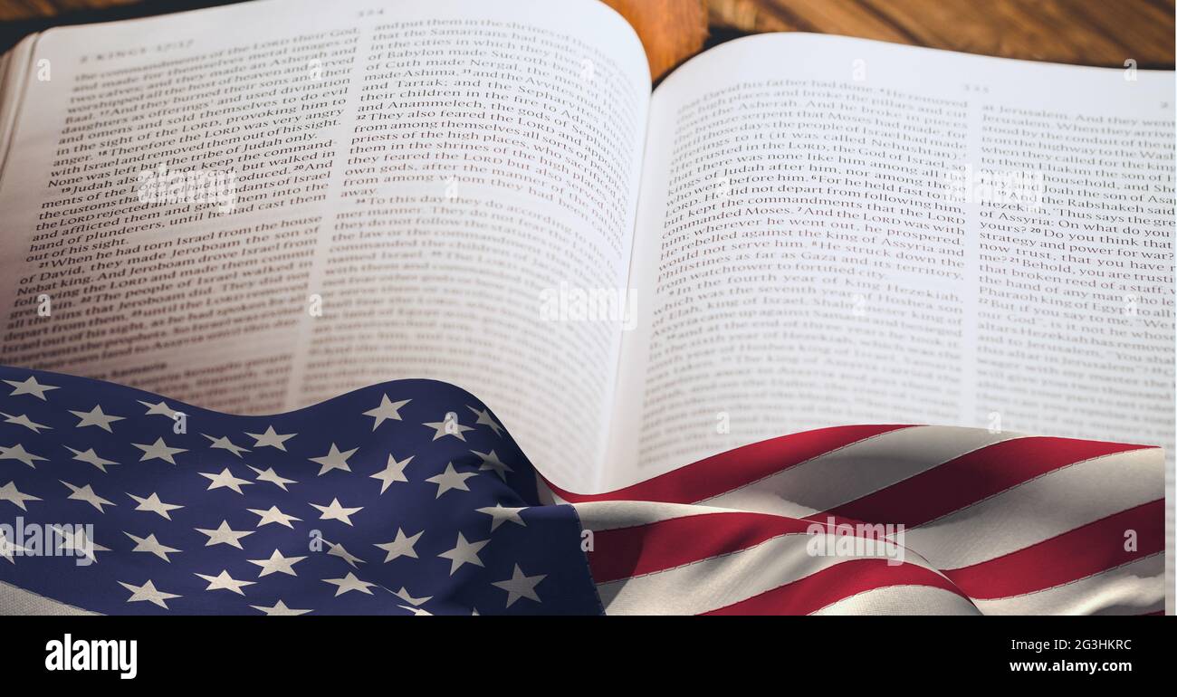 American flag over bible against wooden background Stock Photo - Alamy