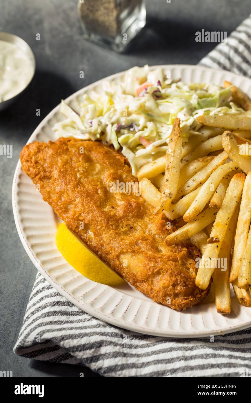 homemade-fried-fish-dinner-with-coleslaw-and-french-fries-stock-photo