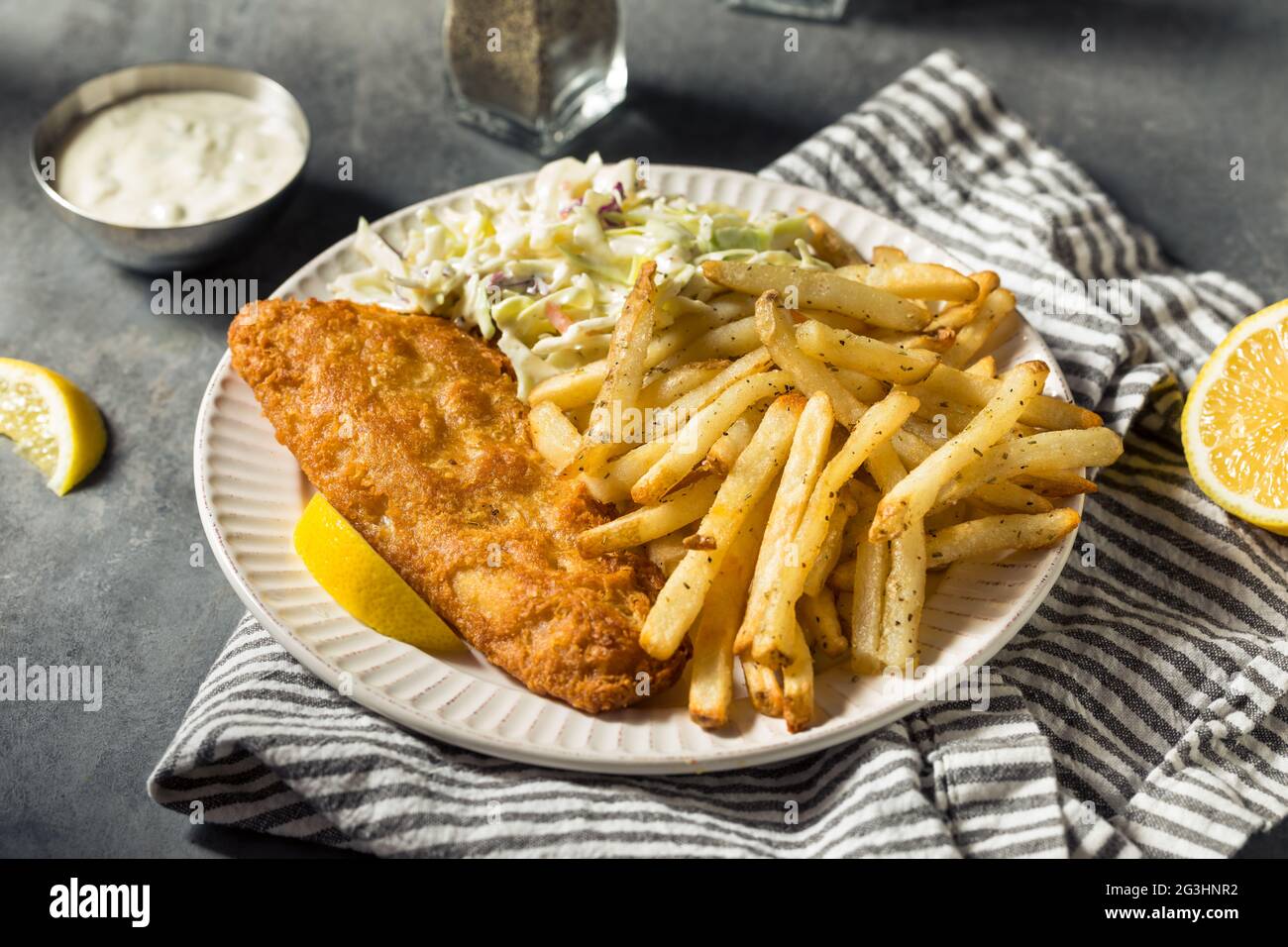 Homemade Fried Fish Dinner with Coleslaw and French Fries Stock Photo