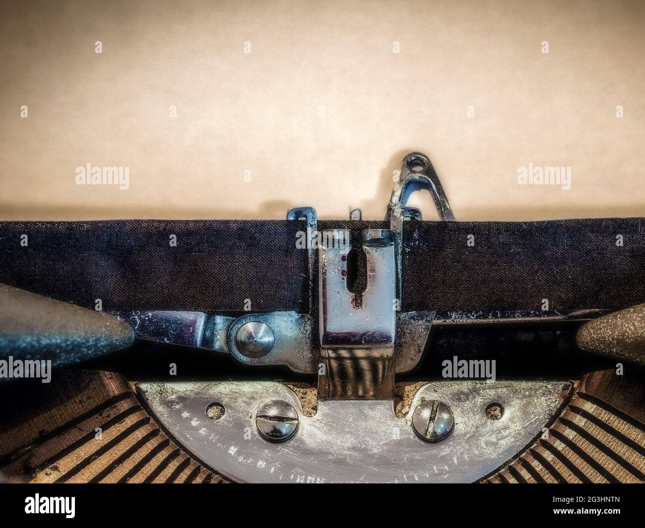Typewriter close-up with a blank sheet of paper loaded Stock Photo