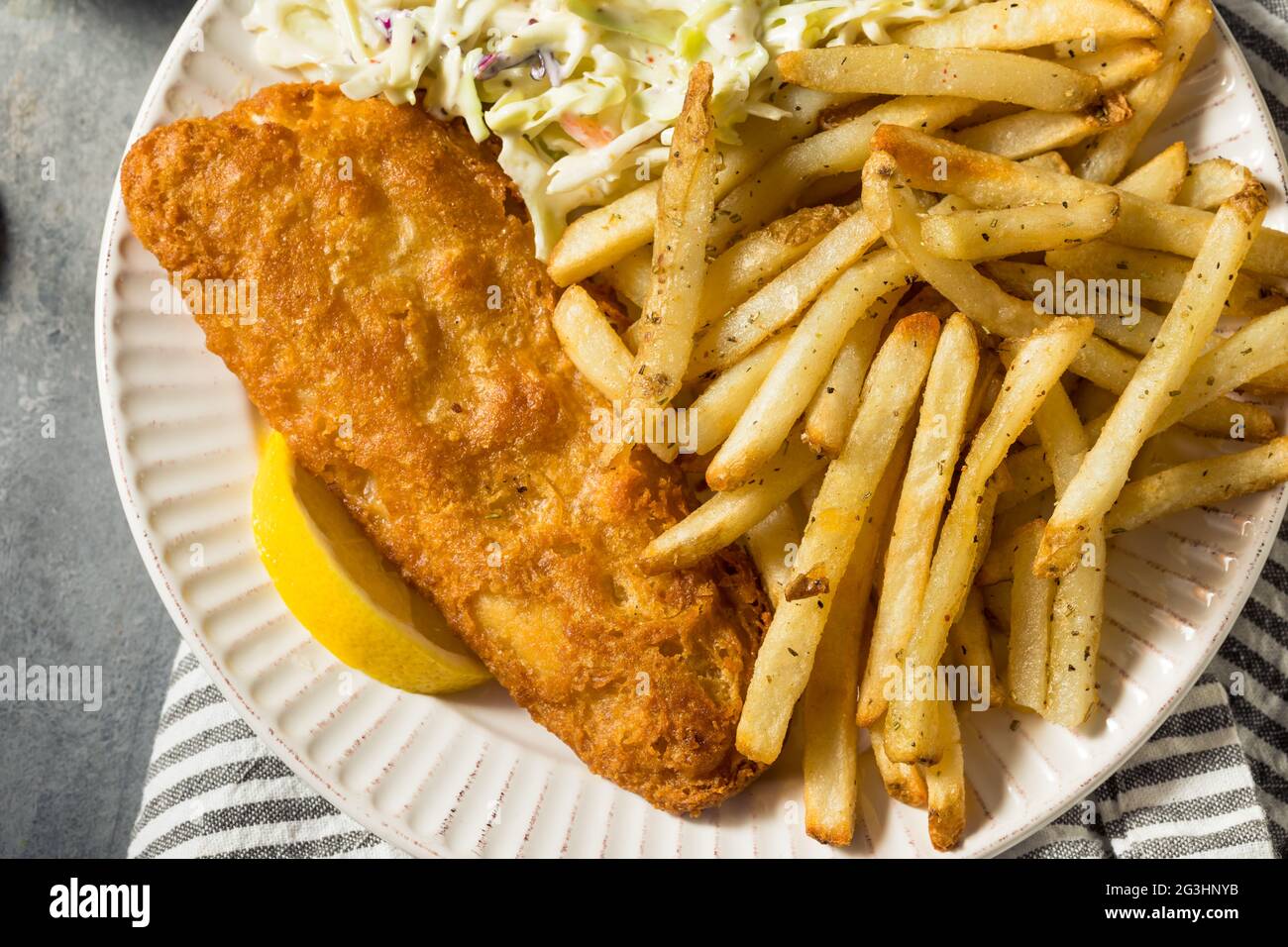 Homemade Fried Fish Dinner with Coleslaw and French Fries Stock Photo