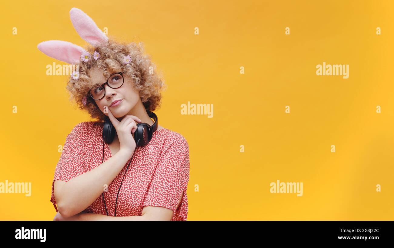 Beautiful Girl Wearing Cute Bunny Ears Hairband And Nerdy Spectacles