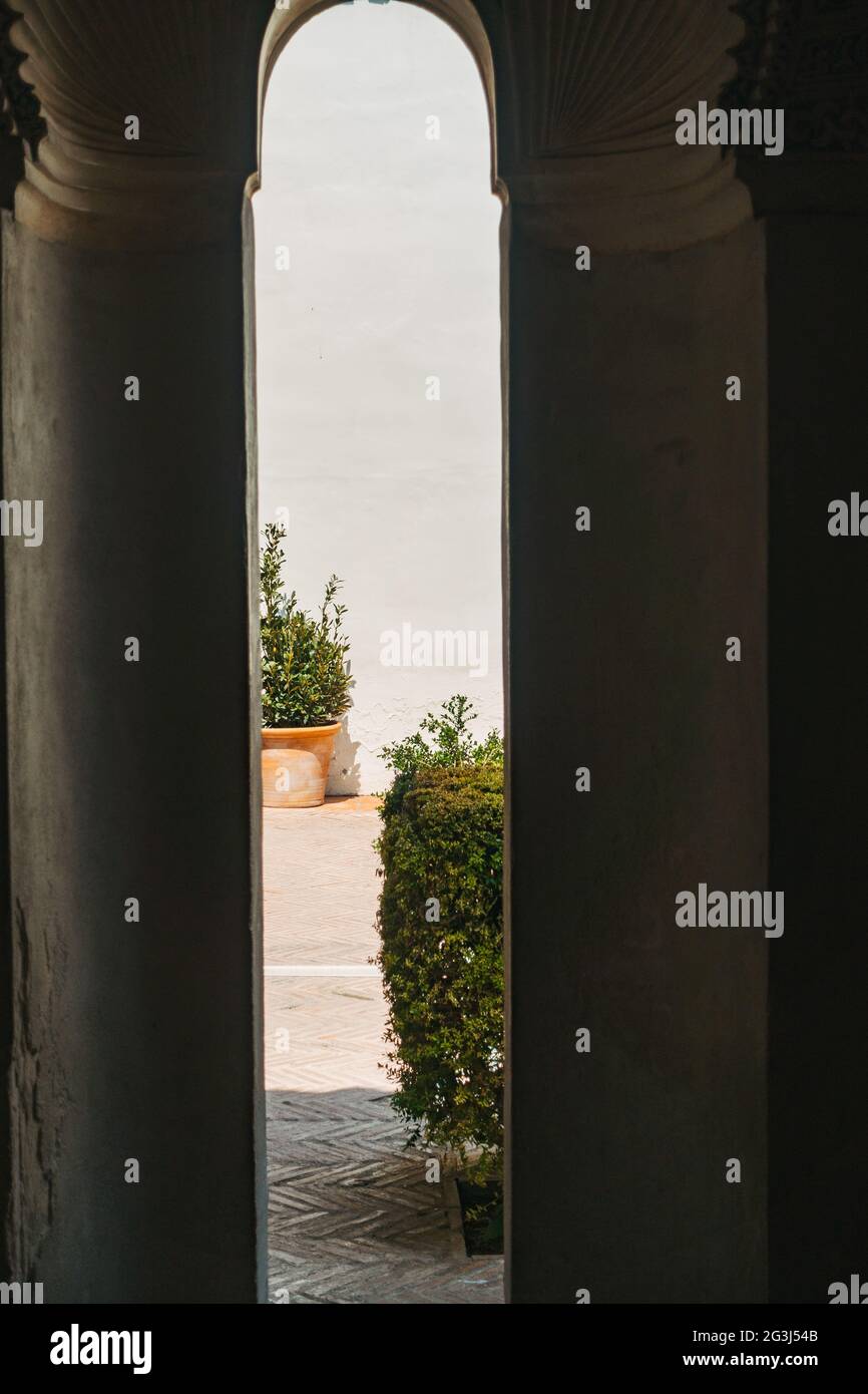Viewing through the keyhole-shaped windows of the Alcazaba, an 11th ...