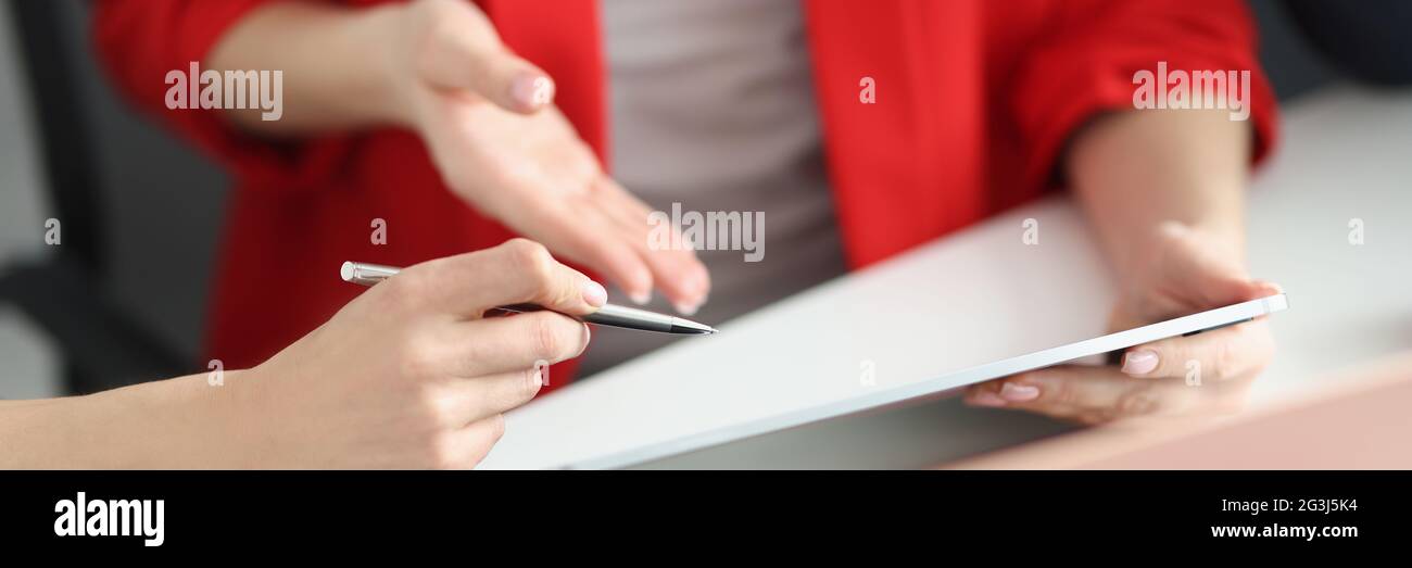 Partners discuss working moments on tablet closeup Stock Photo