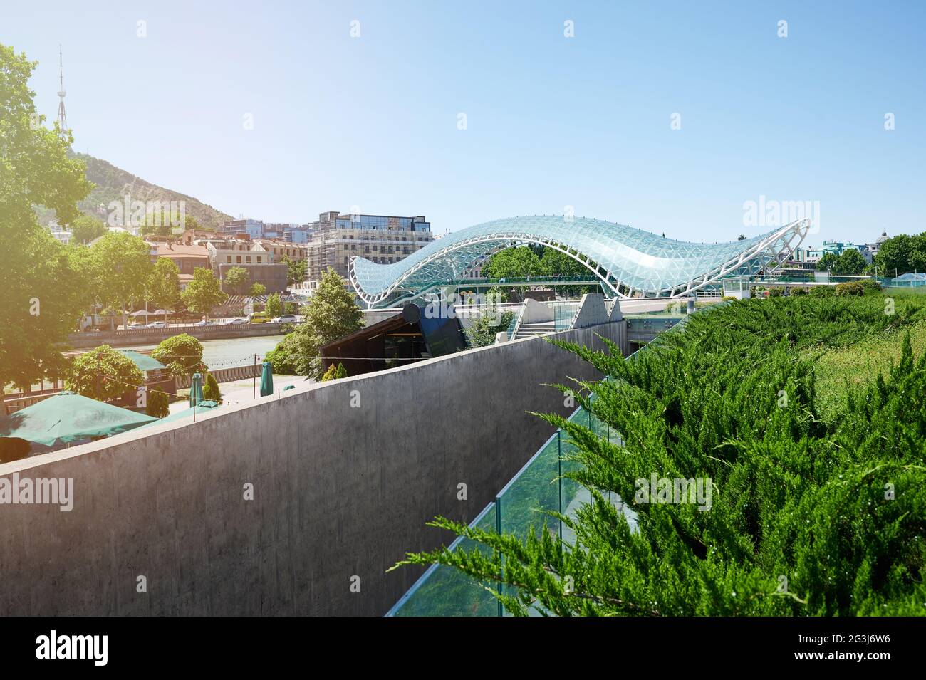 Glass bridge in Tbilisi city on old town background Stock Photo