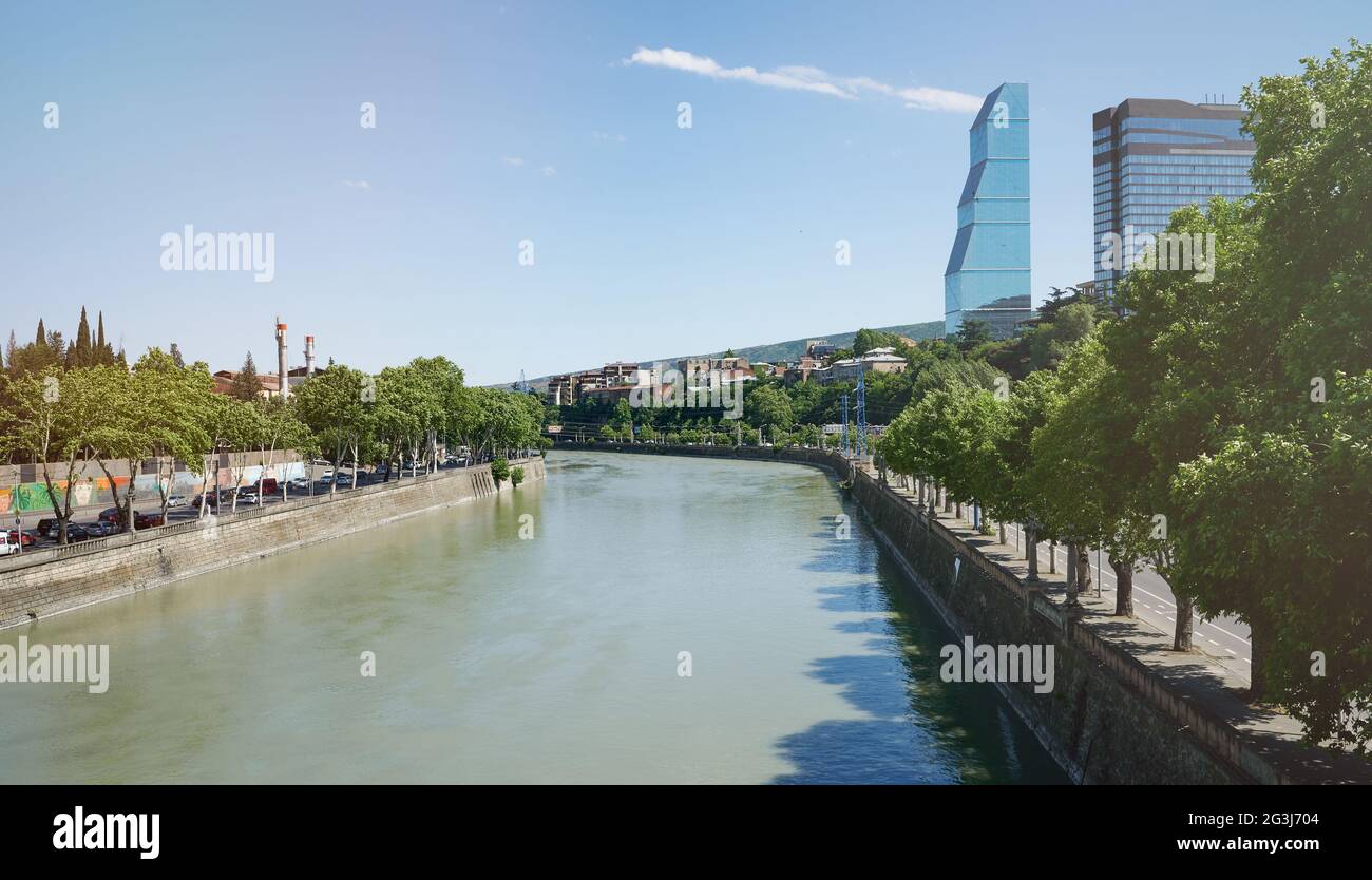Kura river shore in Tbilisi city on bright sunny day Stock Photo