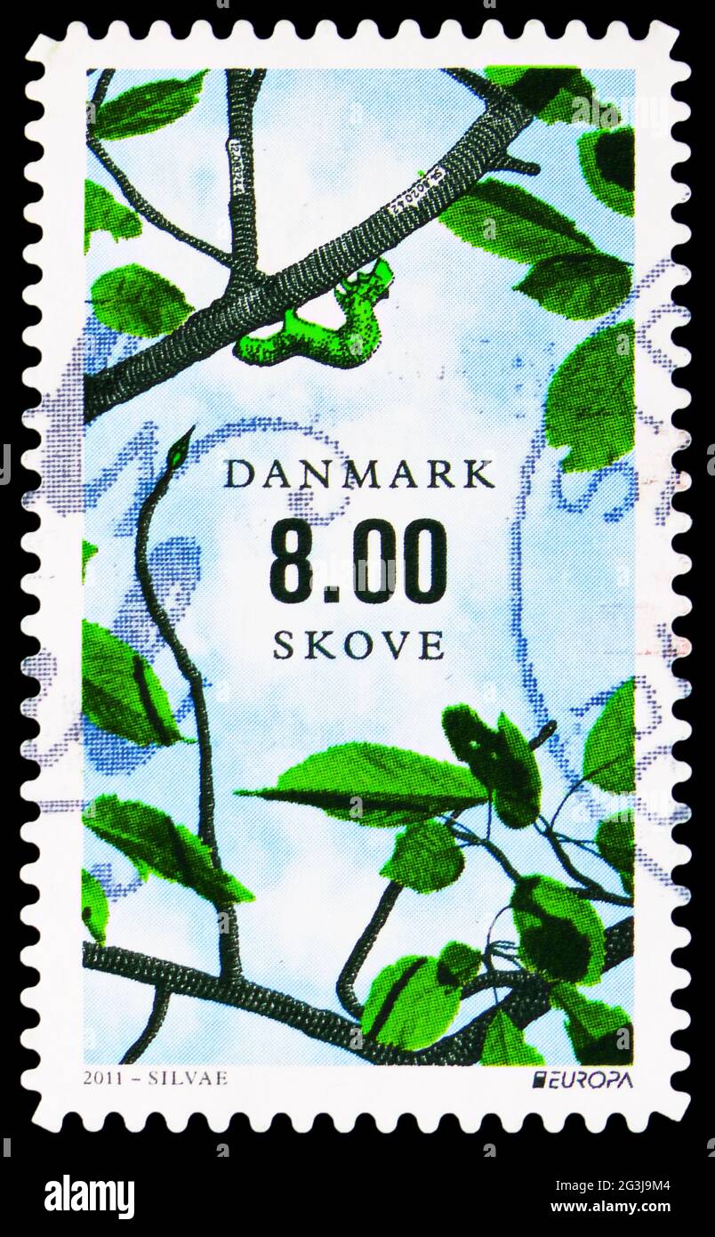 MOSCOW, RUSSIA - APRIL 17, 2021: Postage stamp printed in Denmark shows Spanworm (Geometridae) on Branch, Europa (C.E.P.T.) 2011 - Forests serie, circ Stock Photo