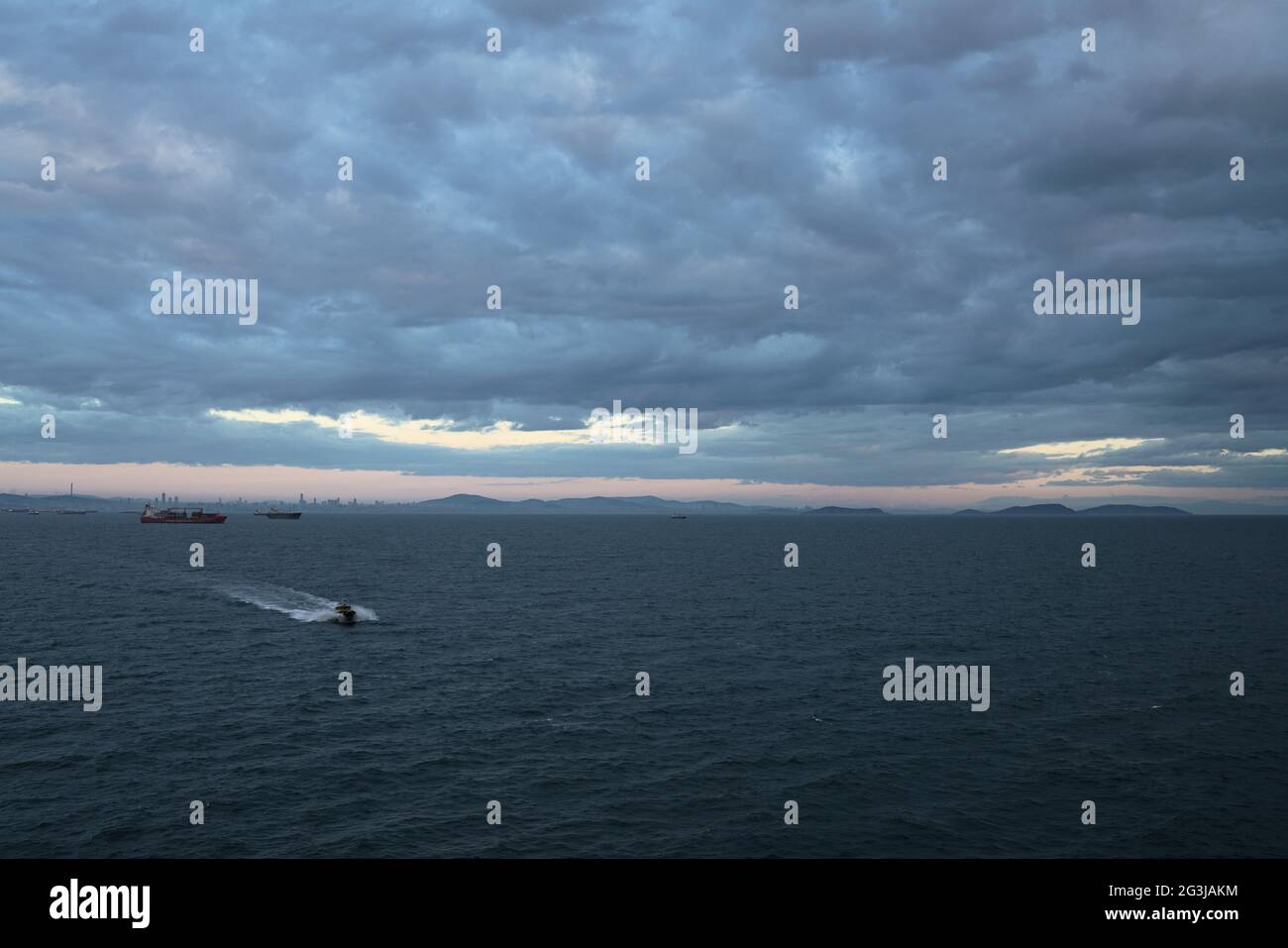 agent boat, pilot boat proceeding to anchorage area with high speed Stock Photo