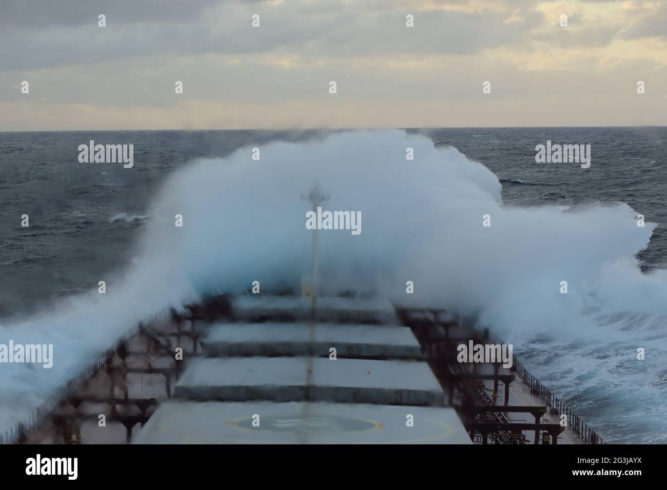 Storm at sea - waves crashing over the boat, view from the bridge Stock Photo
