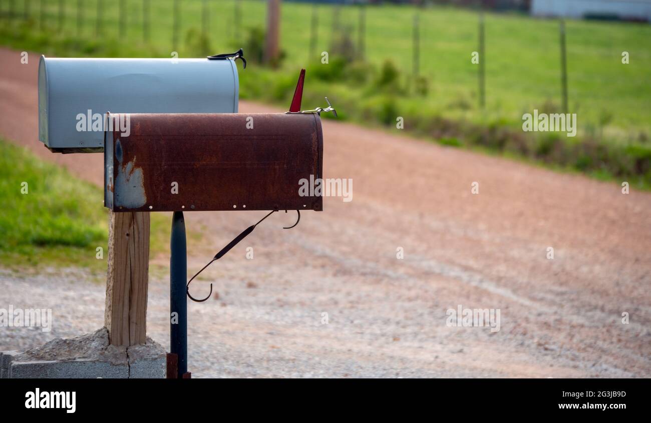Two mailboxes in a country setting portray a feeling of expectancy and anticipation as to what correspondence will be received and communicated. Bokeh Stock Photo