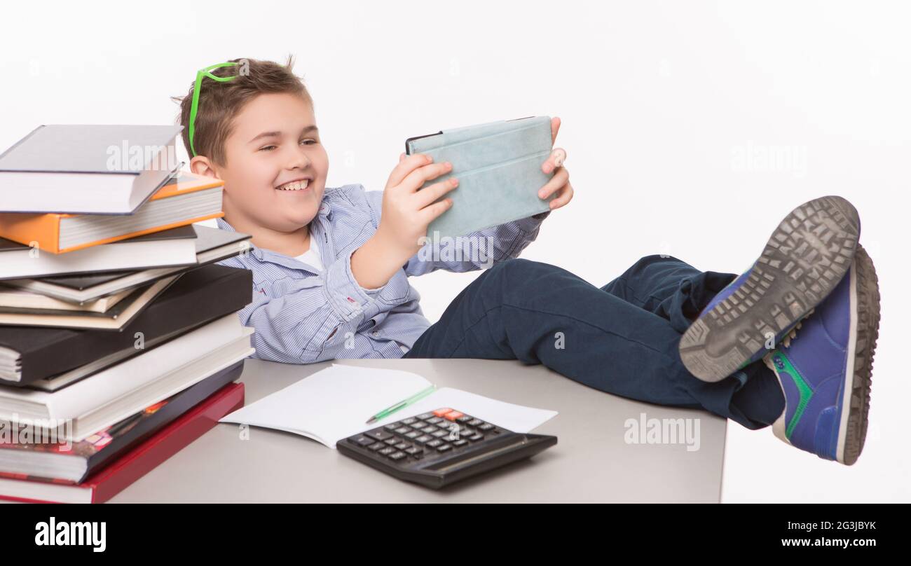 Little boy playing with his tablet PC Stock Photo - Alamy