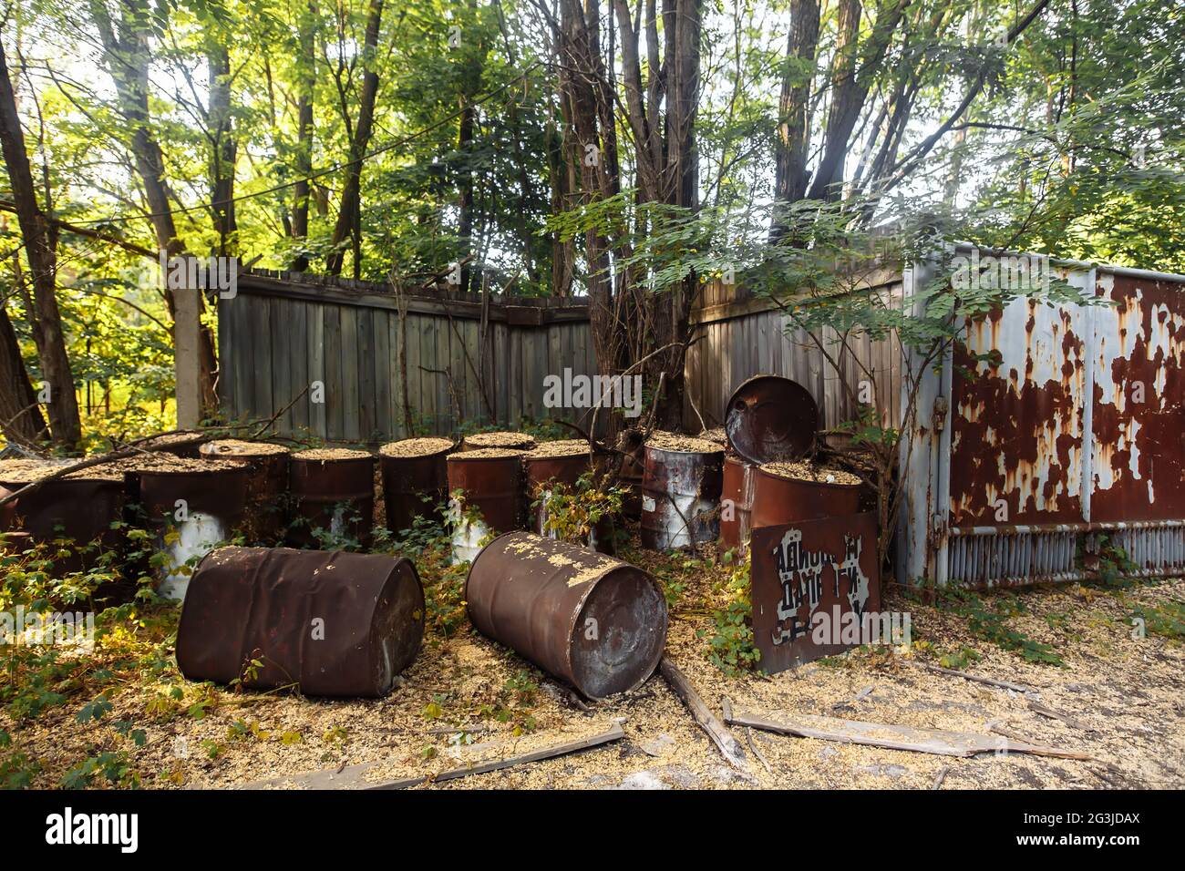 Rusty metal barrels in ghost town Pripyat, Chernobyl Exclusion Zone, nuclear meltdown catastrophe Stock Photo