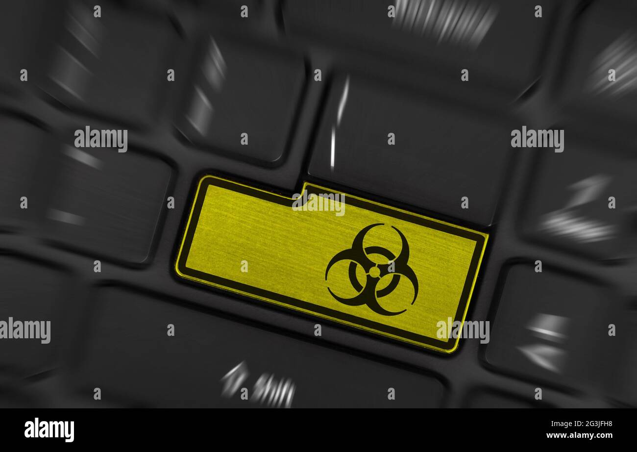 Symbol on button keyboard, biohazard Stock Photo - Alamy