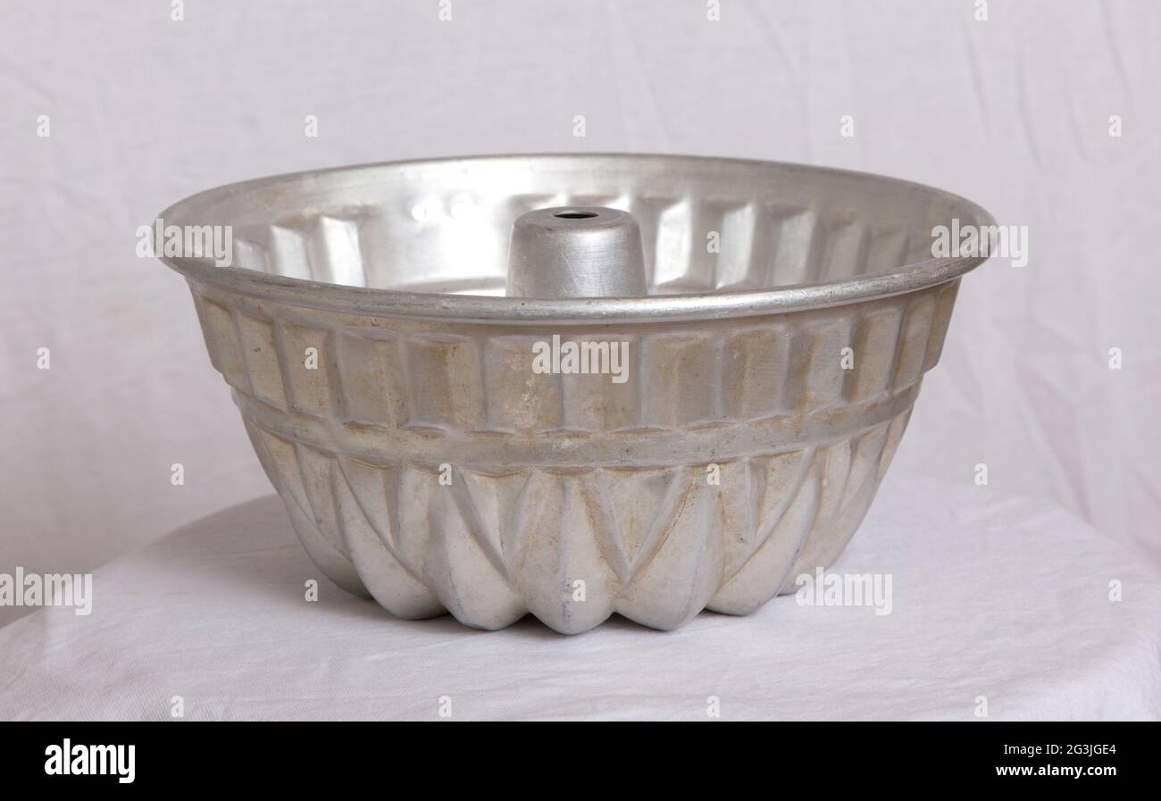 Old fluted tube baking pan isolated Stock Photo Alamy