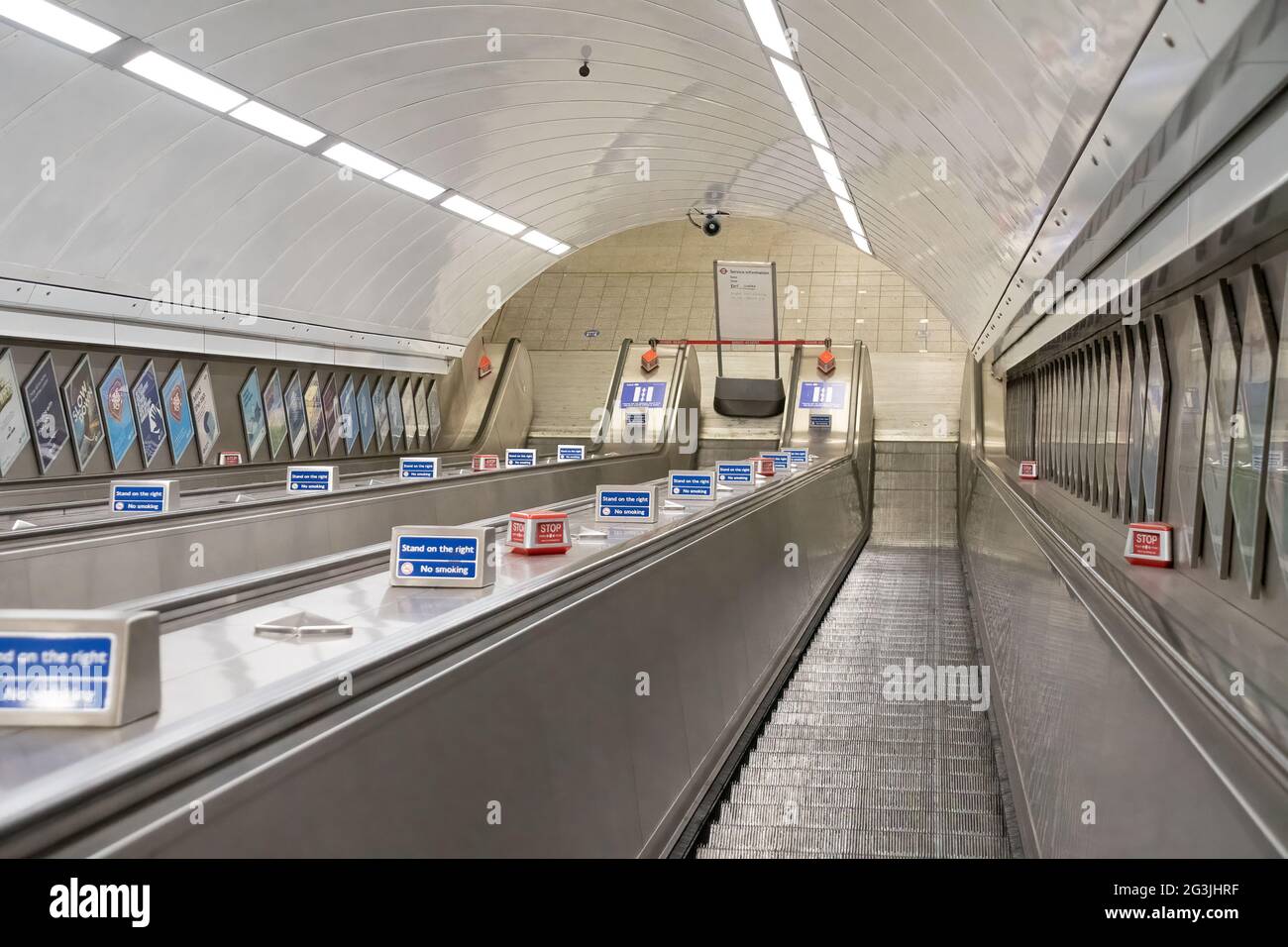 LONDON, UNITED KINGDOM - MAY 20th, 2021: View looking down a moving escalator Stock Photo