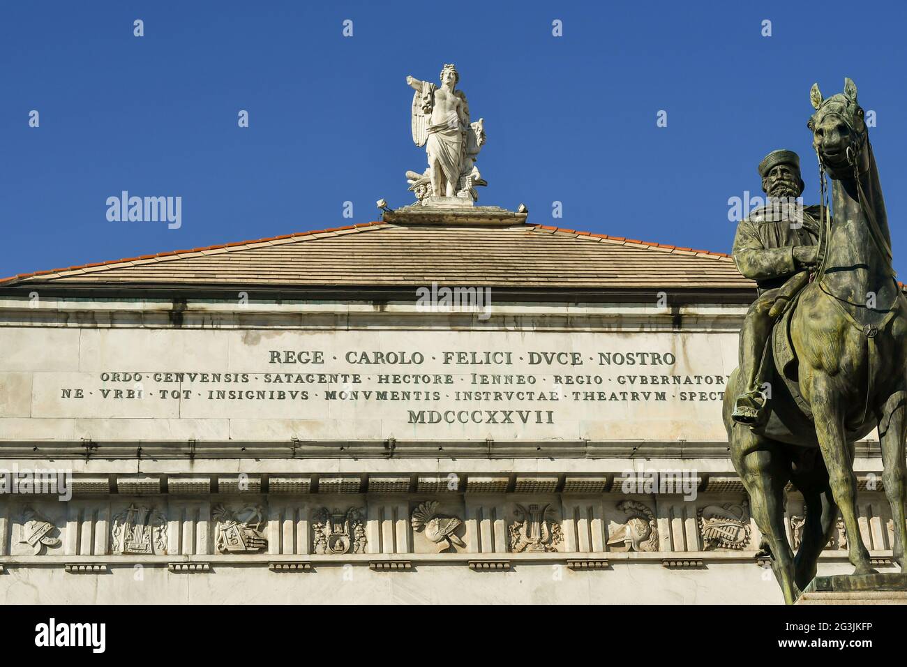 Equestrian statue of Giuseppe Garibaldi and top of the Carlo Felice Theatre with the 'Genius of Harmony' statue on the top, Genoa, Liguria, Italy Stock Photo