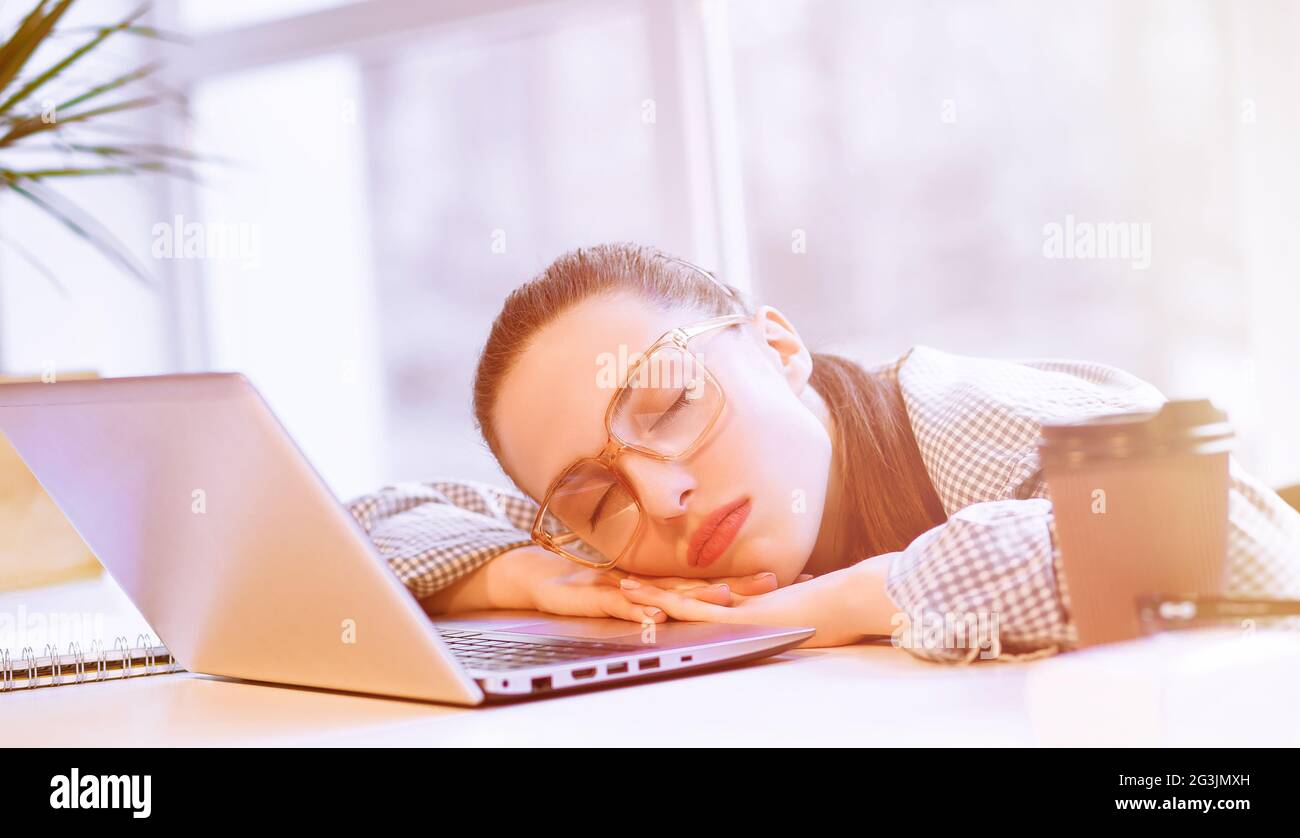 Tired freelance woman Stock Photo
