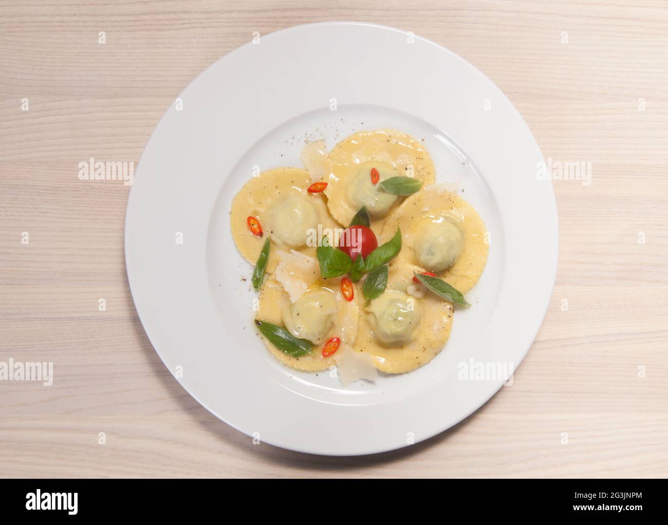 Ravioli with red chily pepper and sweet basil Stock Photo - Alamy
