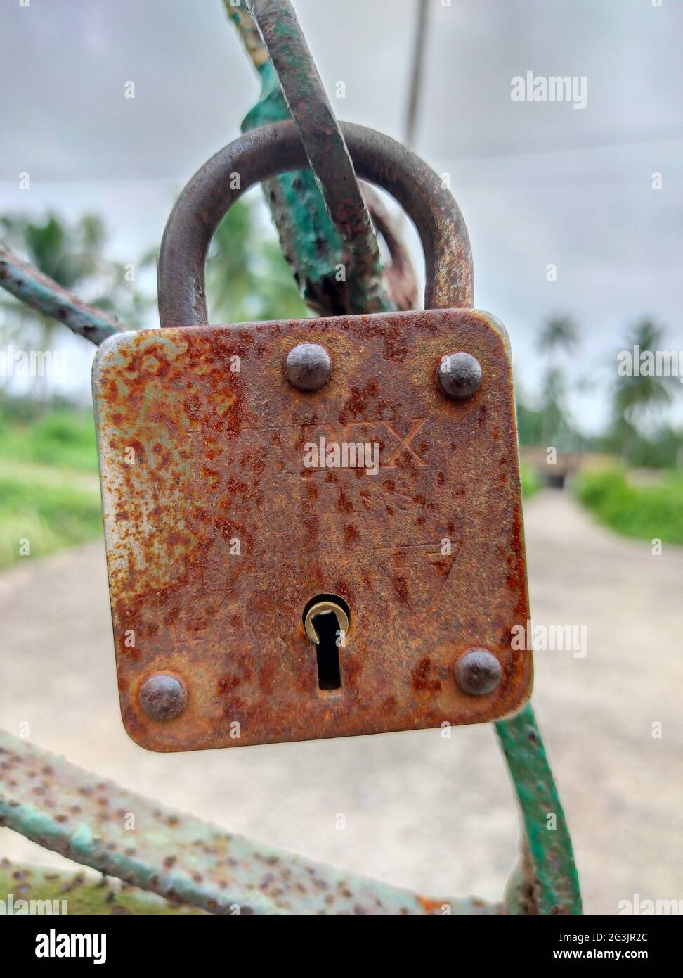 Vertical shot of rusty padlock on a gate Stock Photo - Alamy