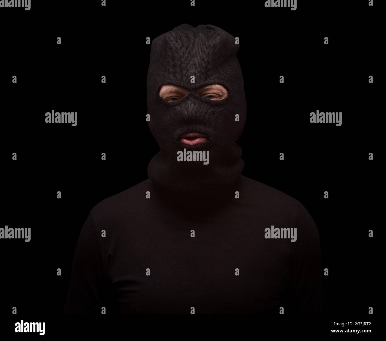Masked thief on black Stock Photo