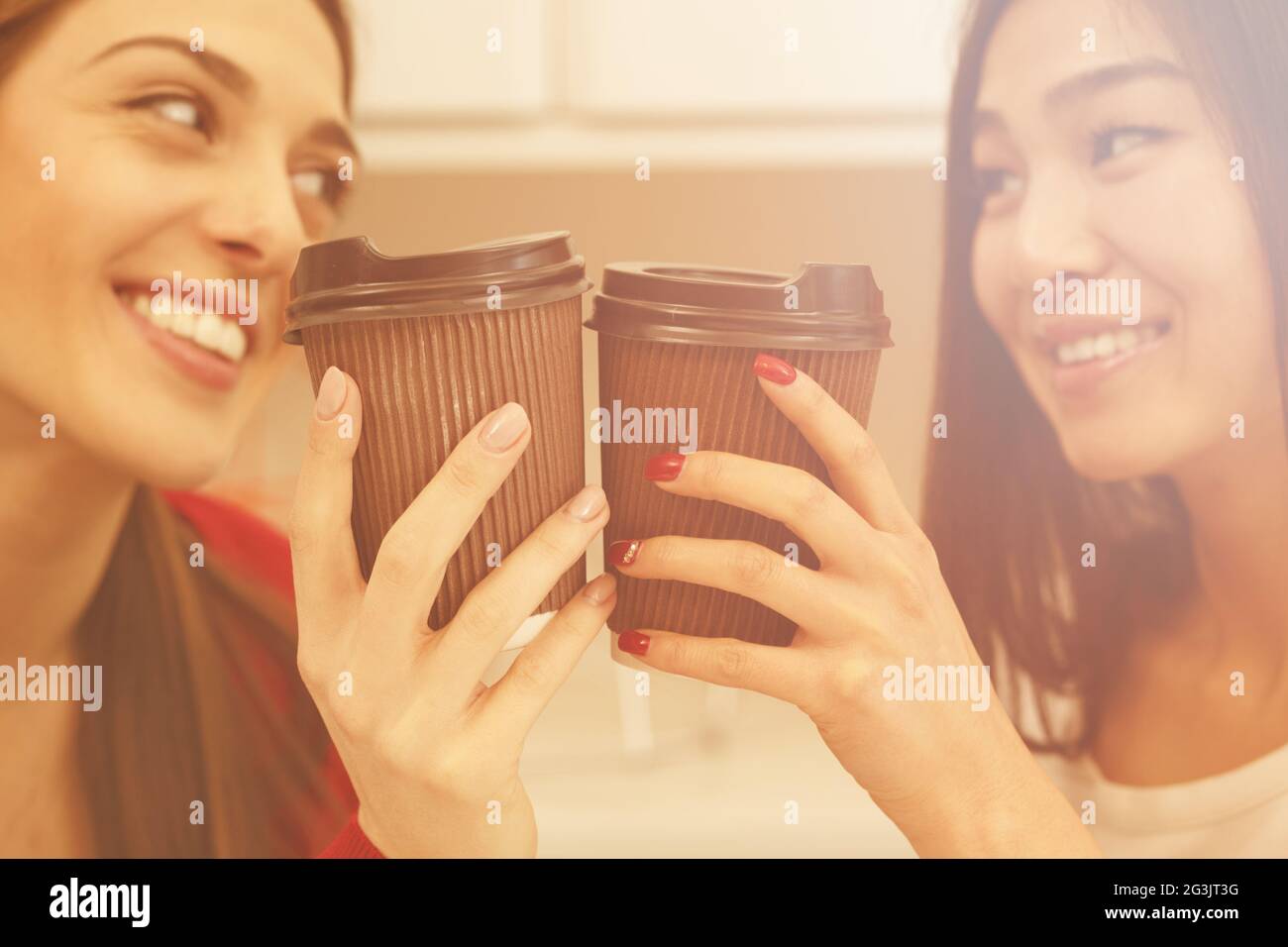 Happy students drinking Stock Photo - Alamy