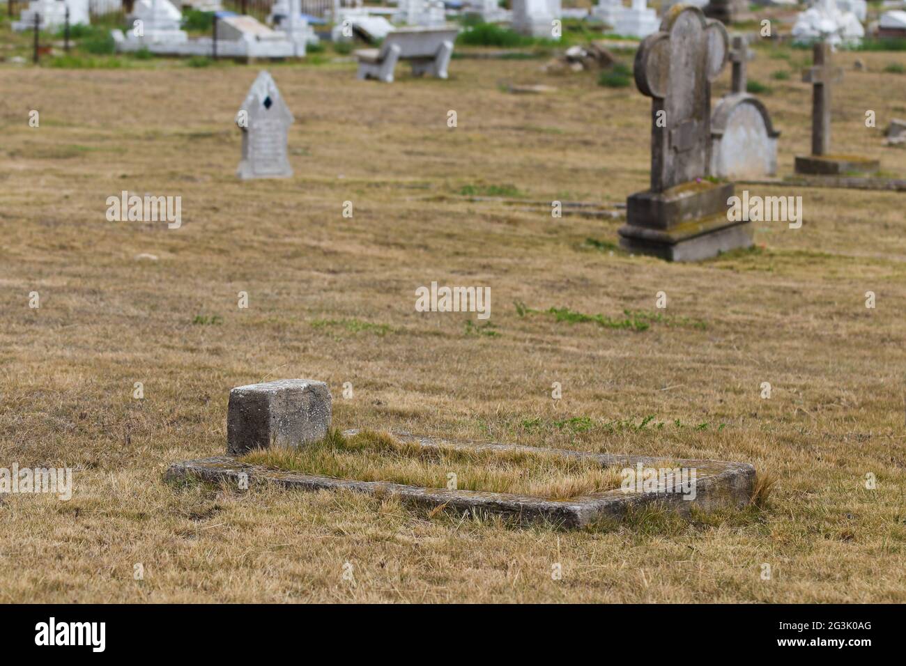 Forgotten Child's Grave In An Old Graveyard Stock Photo