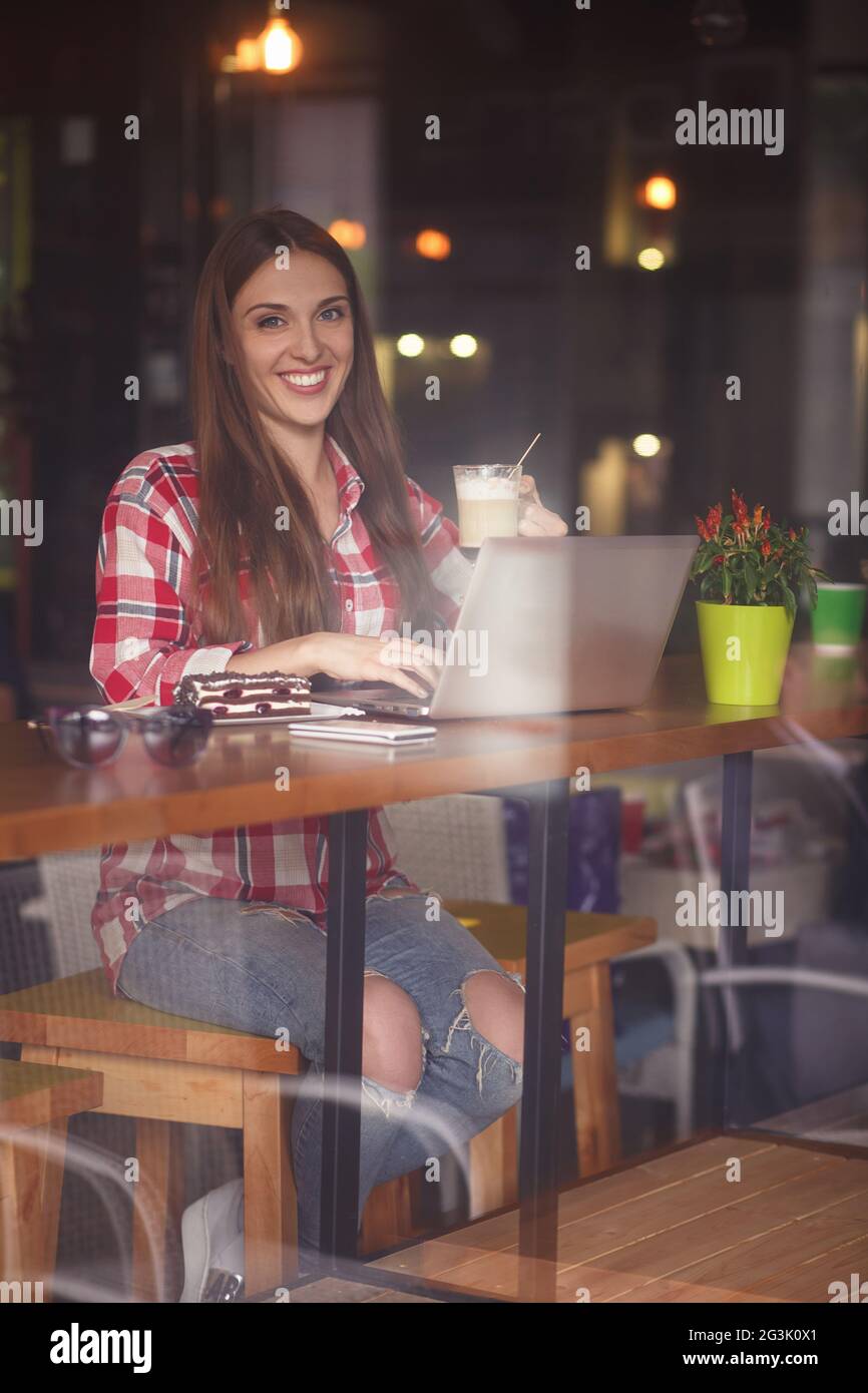 Freelance lady working in cafe Stock Photo