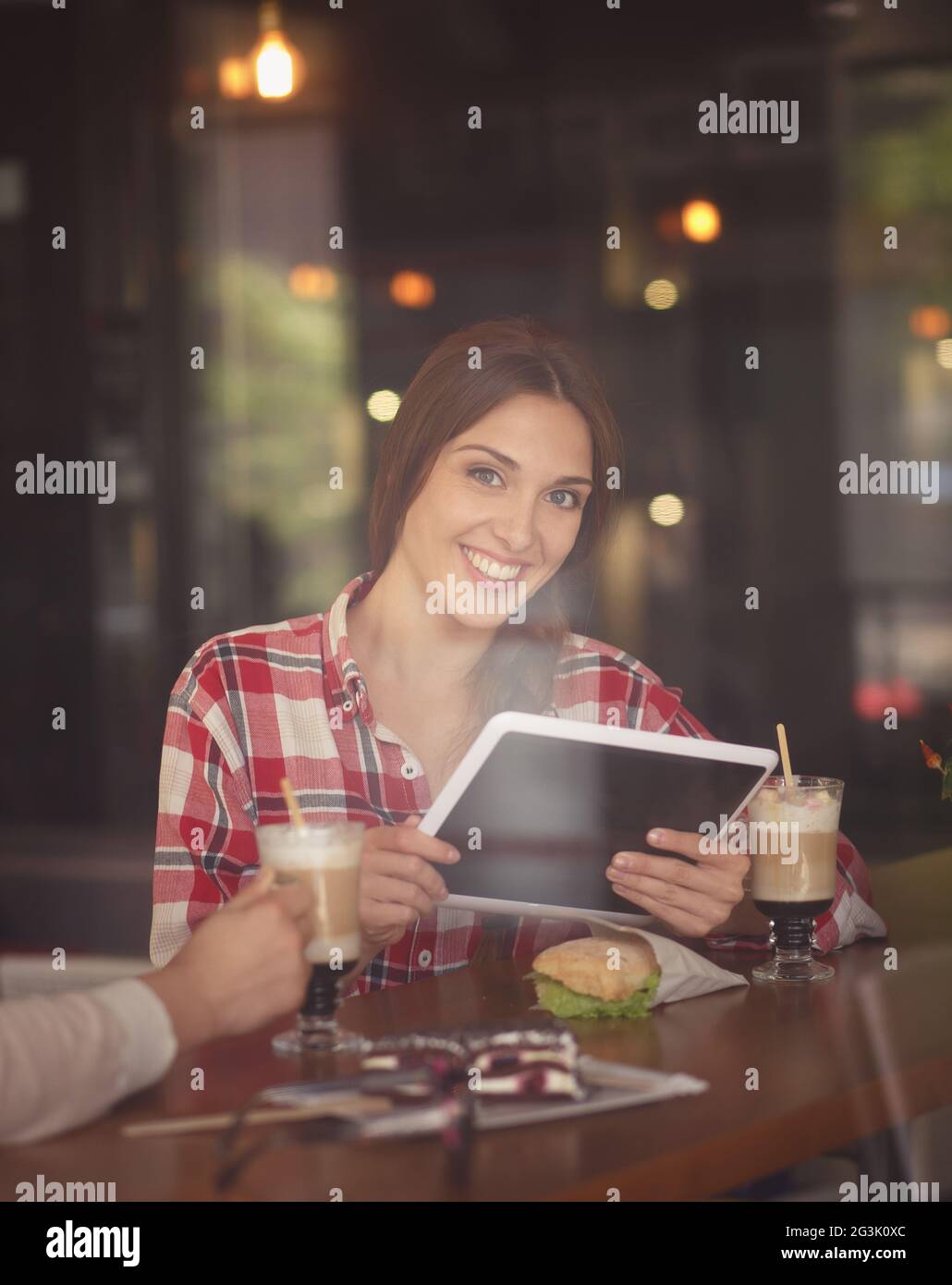 Freelance lady working in cafe Stock Photo